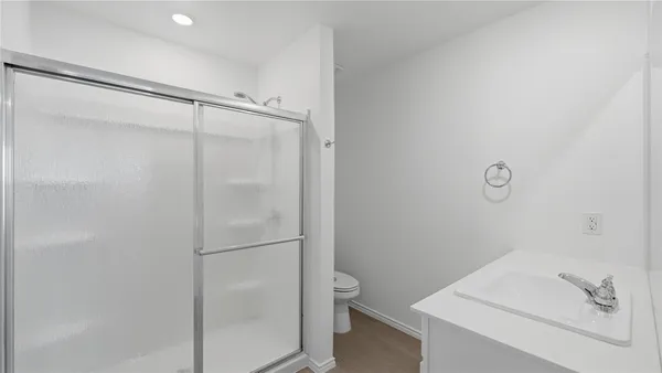 a bathroom with a bathtub a sink and a mirror