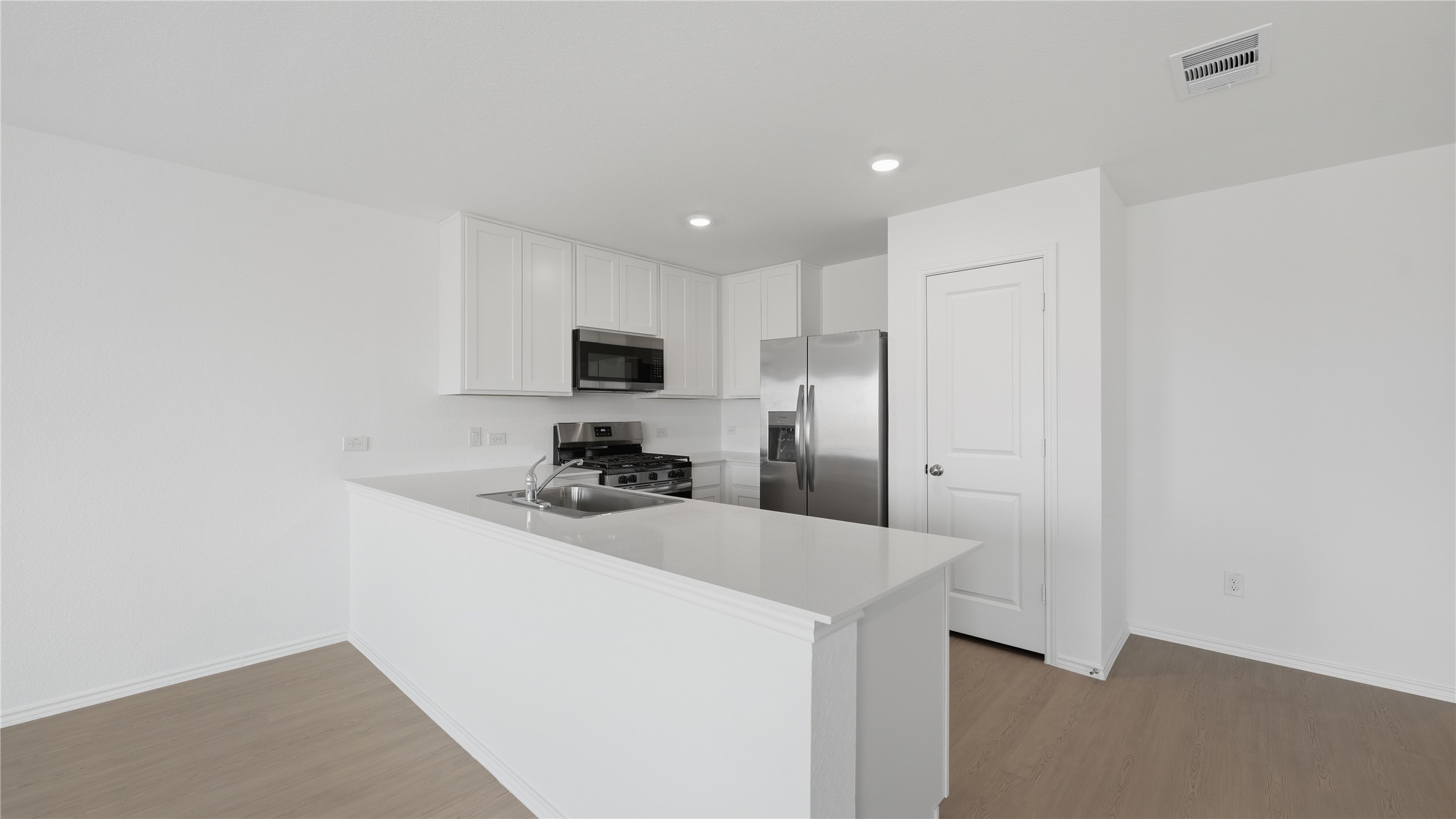 221 Stumpy Street San Marcos, TX 78666 - Photo 6 of 35 a kitchen with stainless steel appliances a sink stove and refrigerator