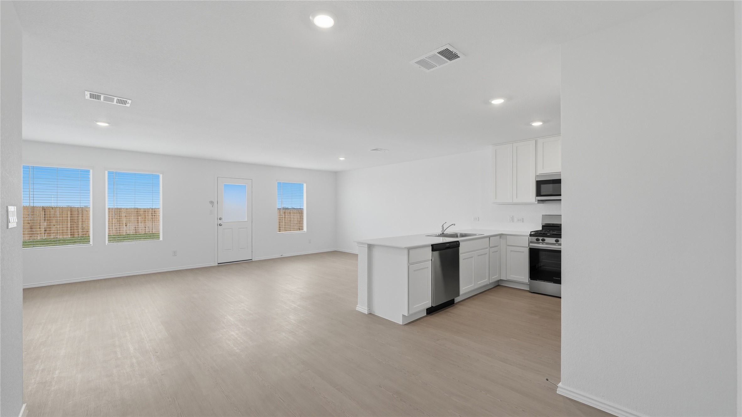 221 Stumpy Street San Marcos, TX 78666 - Photo 35 of 35 a view of a kitchen with a sink and cabinets