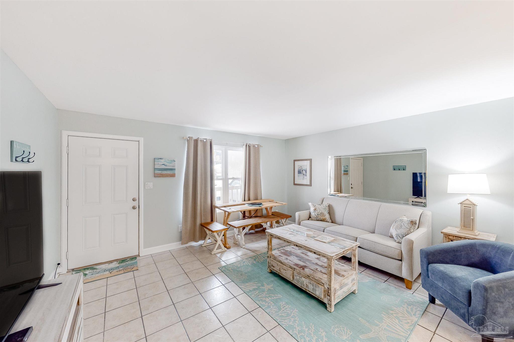 14580 Perdido Key Drive, Unit C3 Perdido Key, FL 32507 - Photo 11 of 17 a living room with furniture and a window