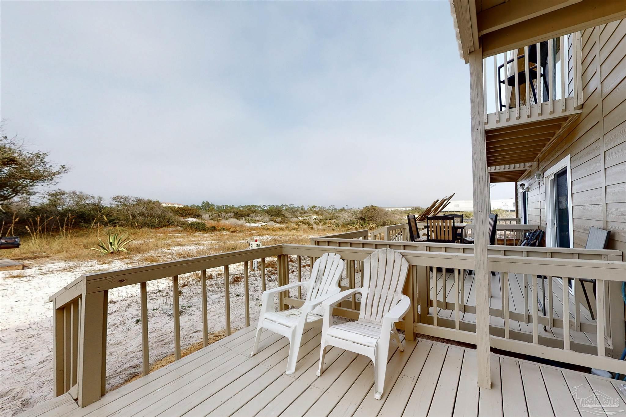 14580 Perdido Key Drive, Unit C3 Perdido Key, FL 32507 - Photo 13 of 17 a view of a roof deck with chair and wooden floor