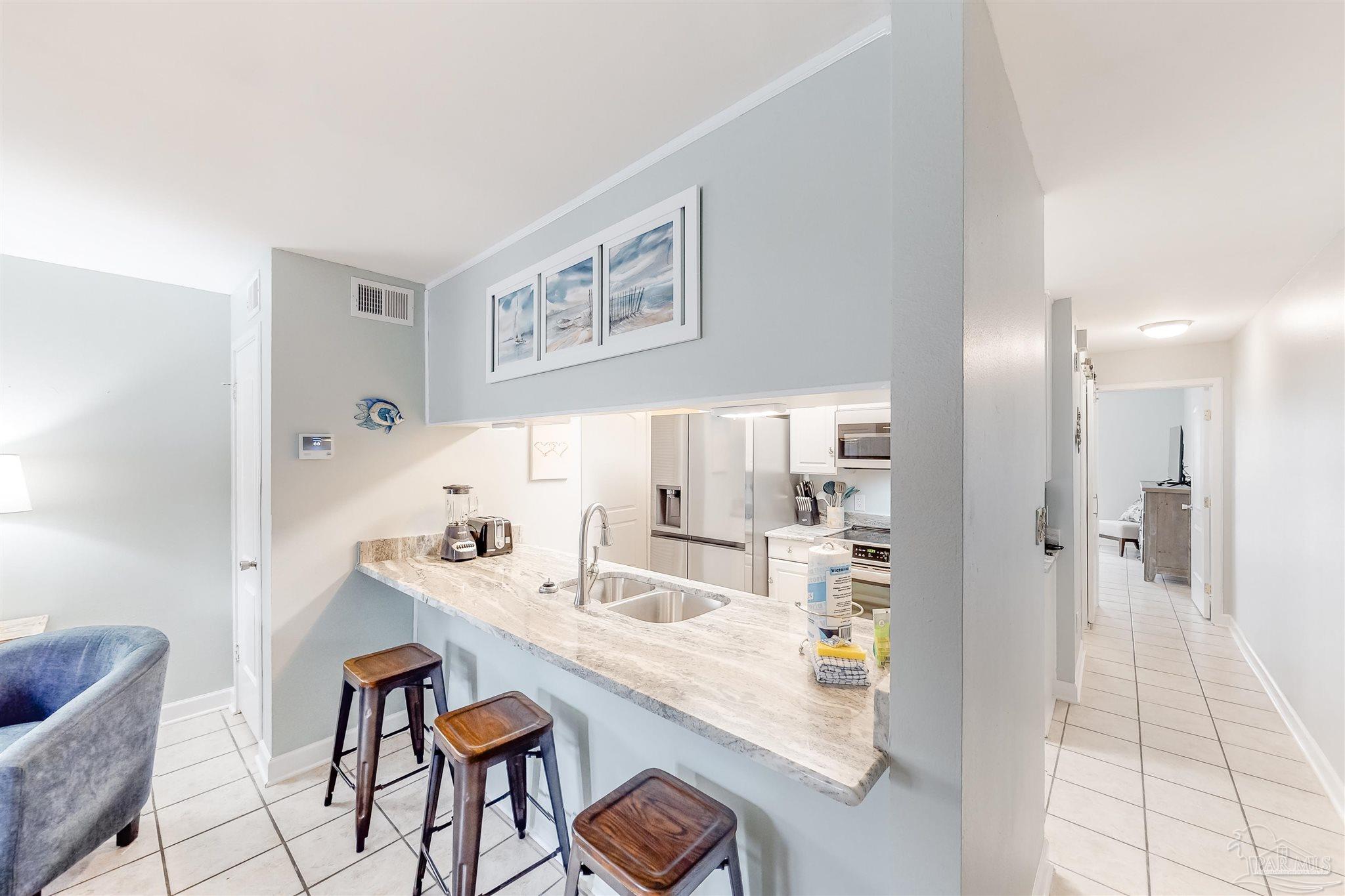 14580 Perdido Key Drive, Unit C3 Perdido Key, FL 32507 - Photo 7 of 17 a dining room with furniture and window