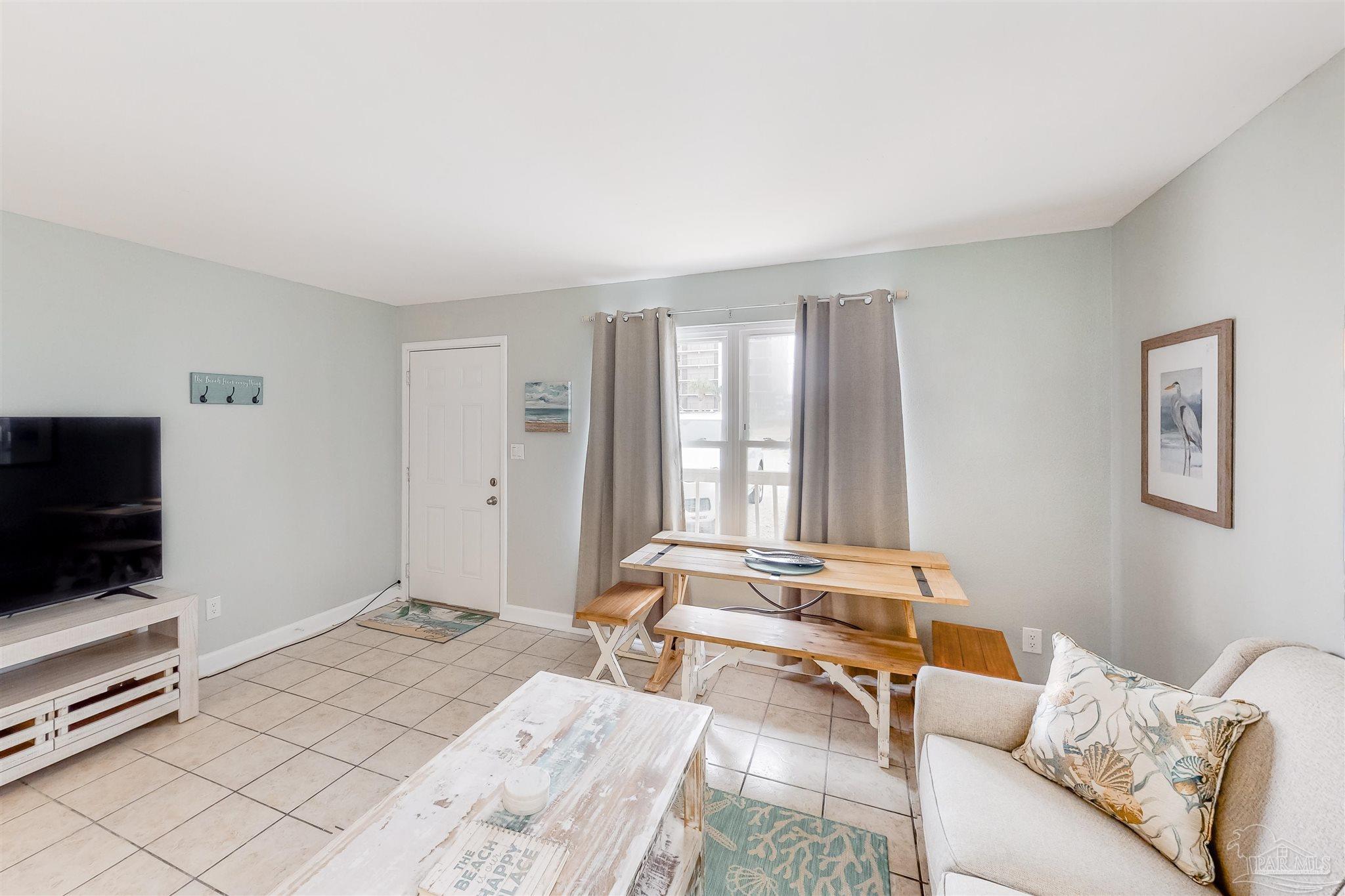 14580 Perdido Key Drive, Unit C3 Perdido Key, FL 32507 - Photo 8 of 17 a bedroom with furniture and a flat screen tv