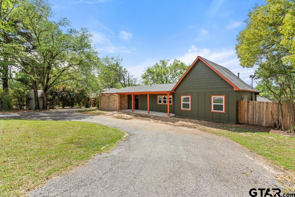 2819 New Copeland Road Tyler, TX 75701 - Photo 3 of 39 a front view of house with yard and trees in the background