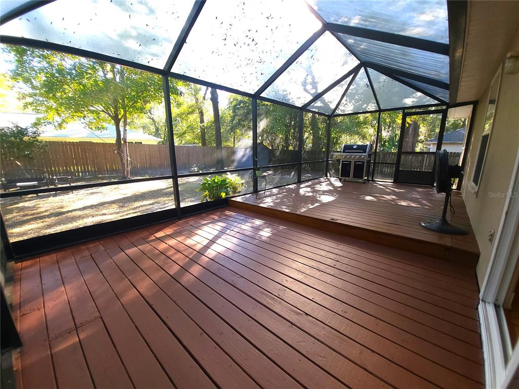 5909 Southwest 86th Drive Gainesville, FL 32608 - Photo 16 of 22 a view of porch with wooden floor