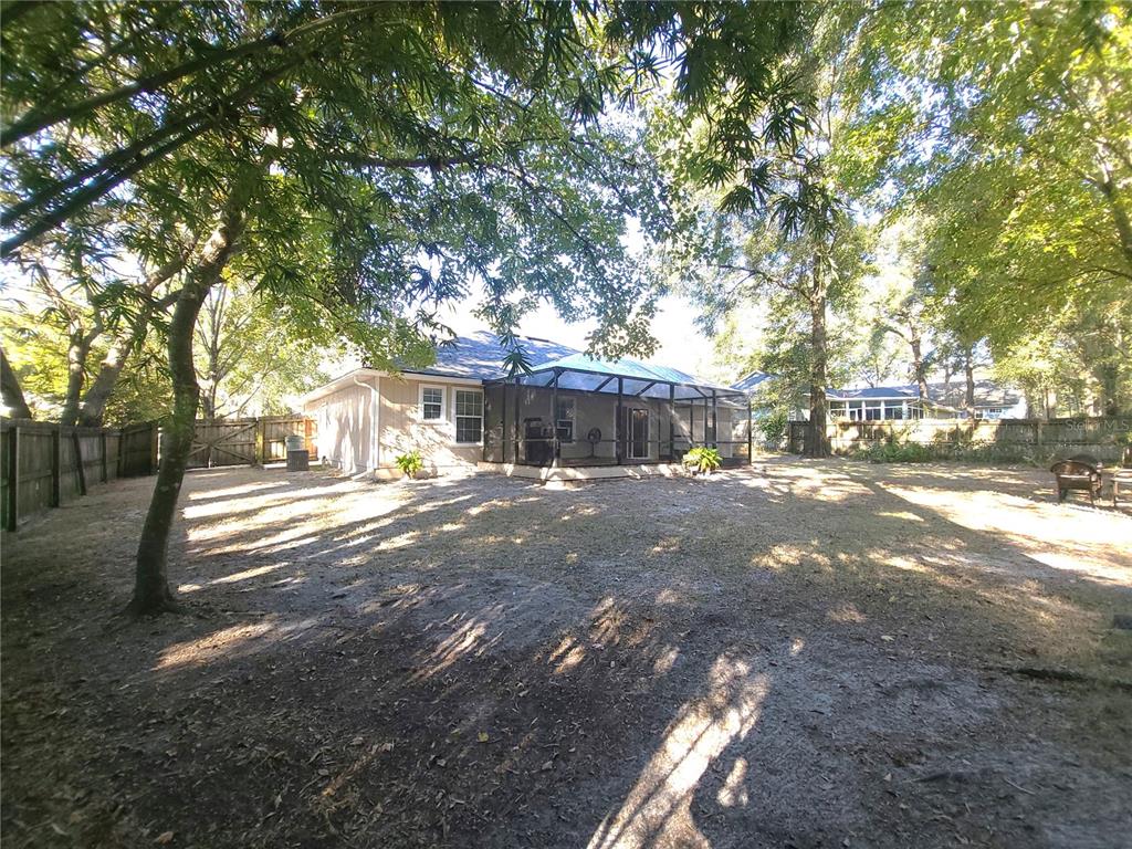 5909 Southwest 86th Drive Gainesville, FL 32608 - Photo 17 of 22 a view of street with trees