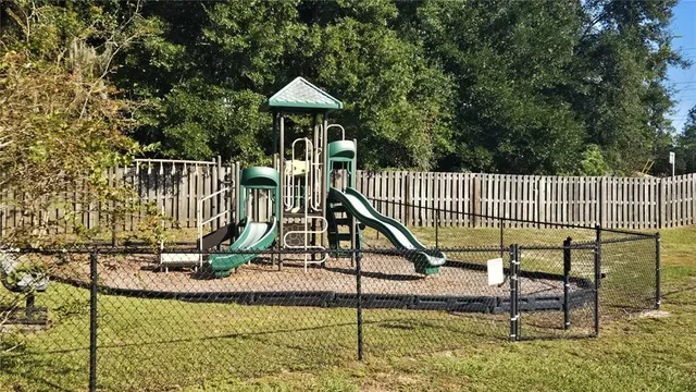 a view of a slide with a wooden deck
