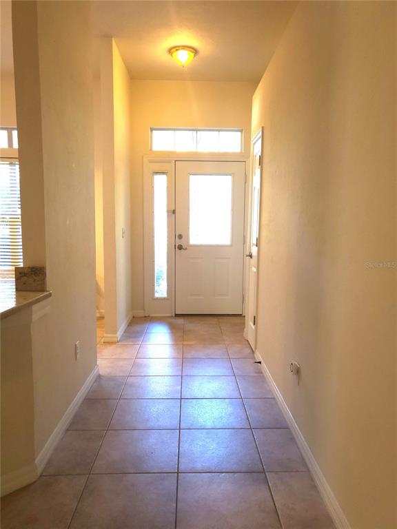5909 Southwest 86th Drive Gainesville, FL 32608 - Photo 2 of 22 a view of an empty room and window