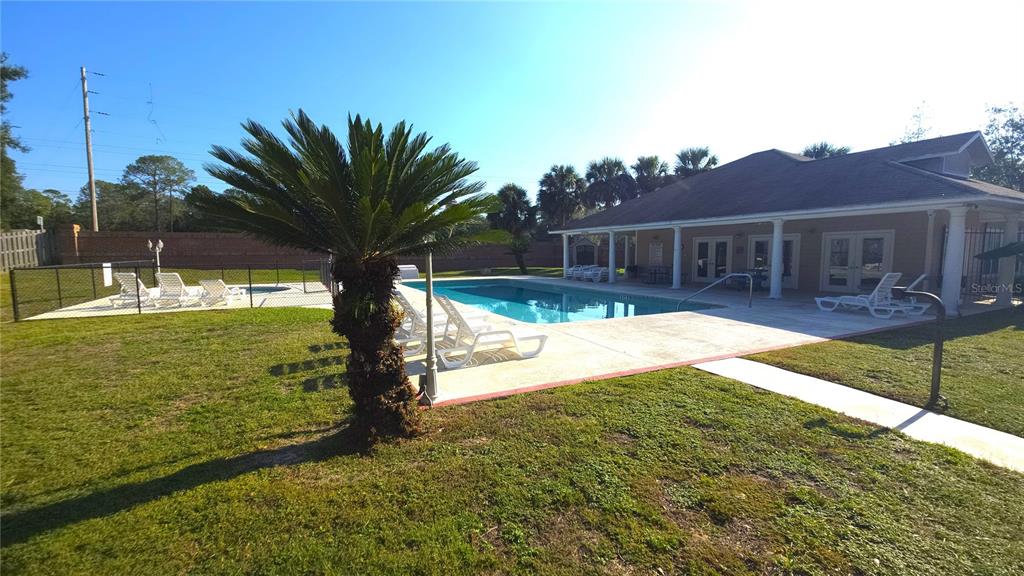 5909 Southwest 86th Drive Gainesville, FL 32608 - Photo 21 of 22 a view of a house with yard and lake view
