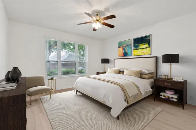 a bedroom with a bed and a couch