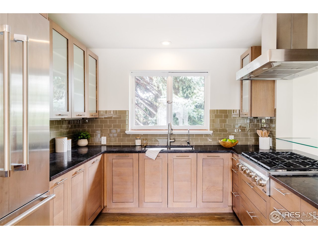 733 13th Street Boulder, CO 80302 - Photo 15 of 35 a kitchen with stainless steel appliances granite countertop a stove a sink and a microwave