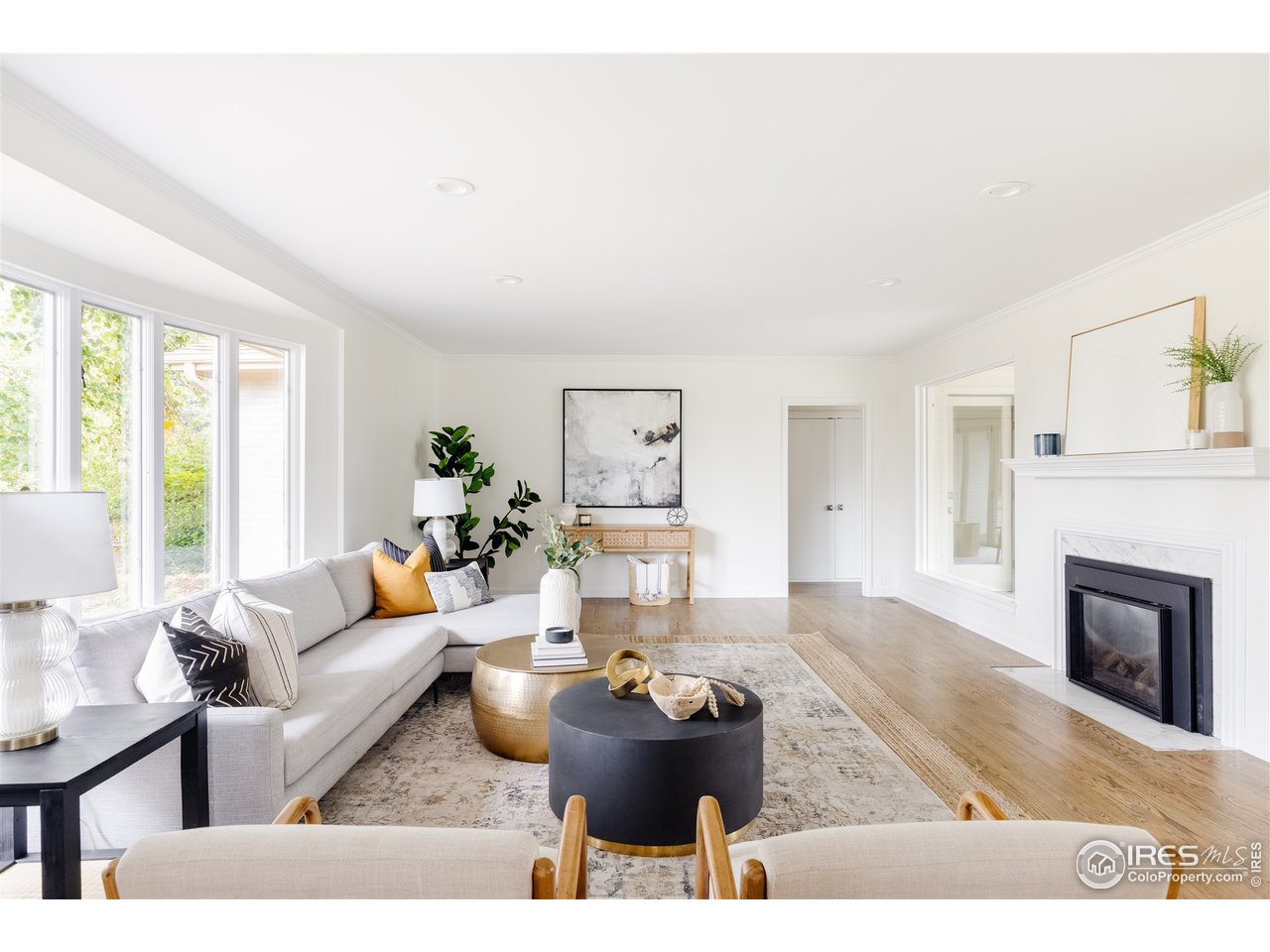 733 13th Street Boulder, CO 80302 - Photo 2 of 35 a living room with furniture and a fireplace