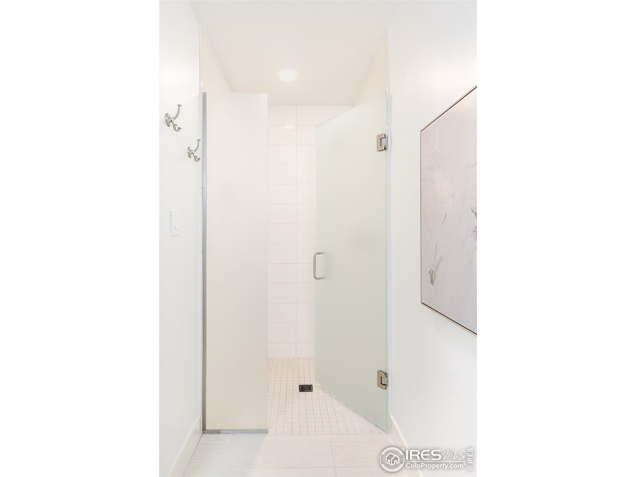 733 13th Street Boulder, CO 80302 - Photo 26 of 35 a bathroom with a shower and a mirror