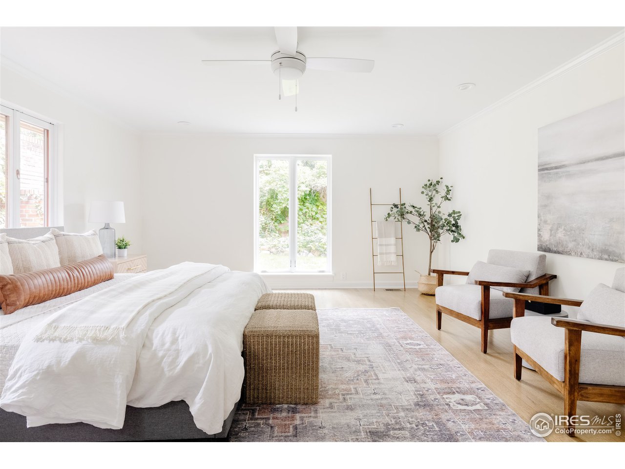 733 13th Street Boulder, CO 80302 - Photo 7 of 35 a bedroom with a bed and a chair