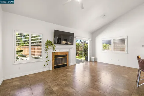 a kitchen with kitchen island a white counter top space a sink and appliances