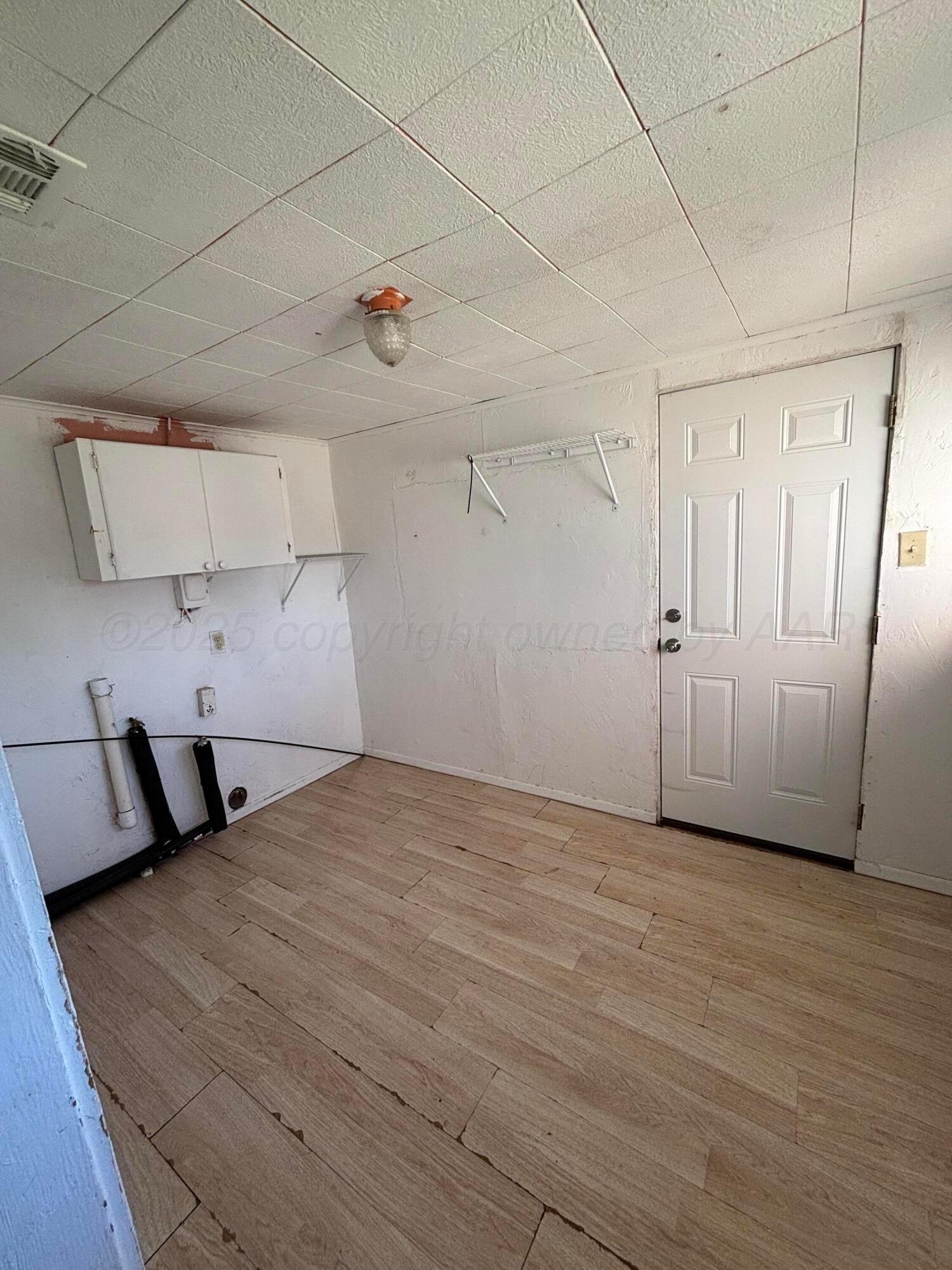 320 West Summit Street Miami, TX 79059 - Photo 13 of 19 a view of a room with wooden floor