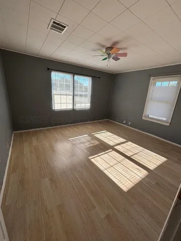 a view of an empty room and window