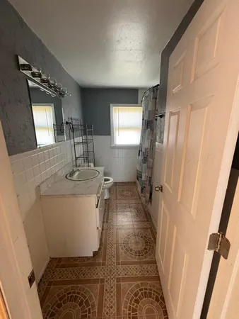 a bathroom with sink and mirror