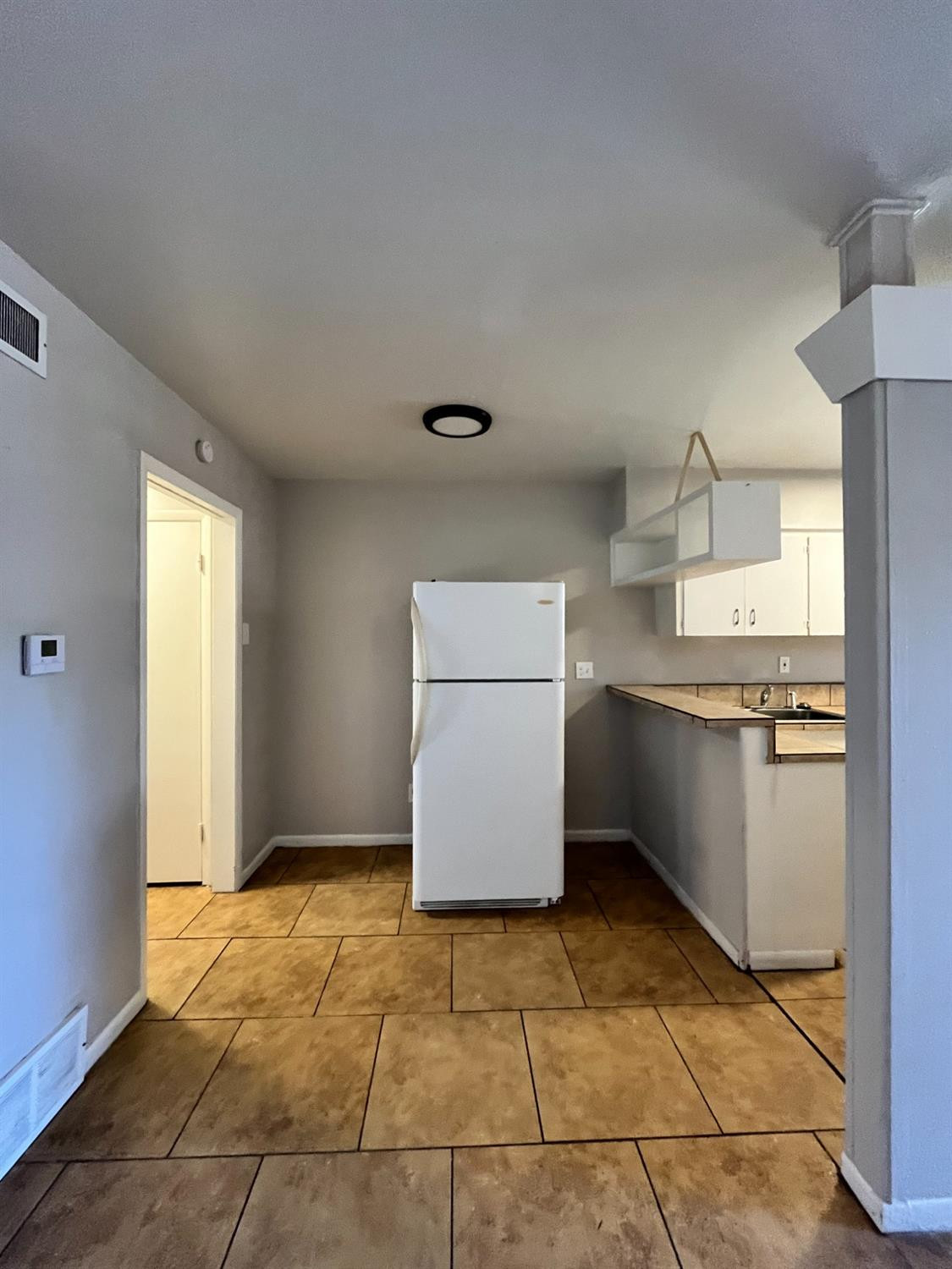1706 26th Street Lubbock, TX 79411 - Photo 2 of 10 a kitchen with a cabinets and window