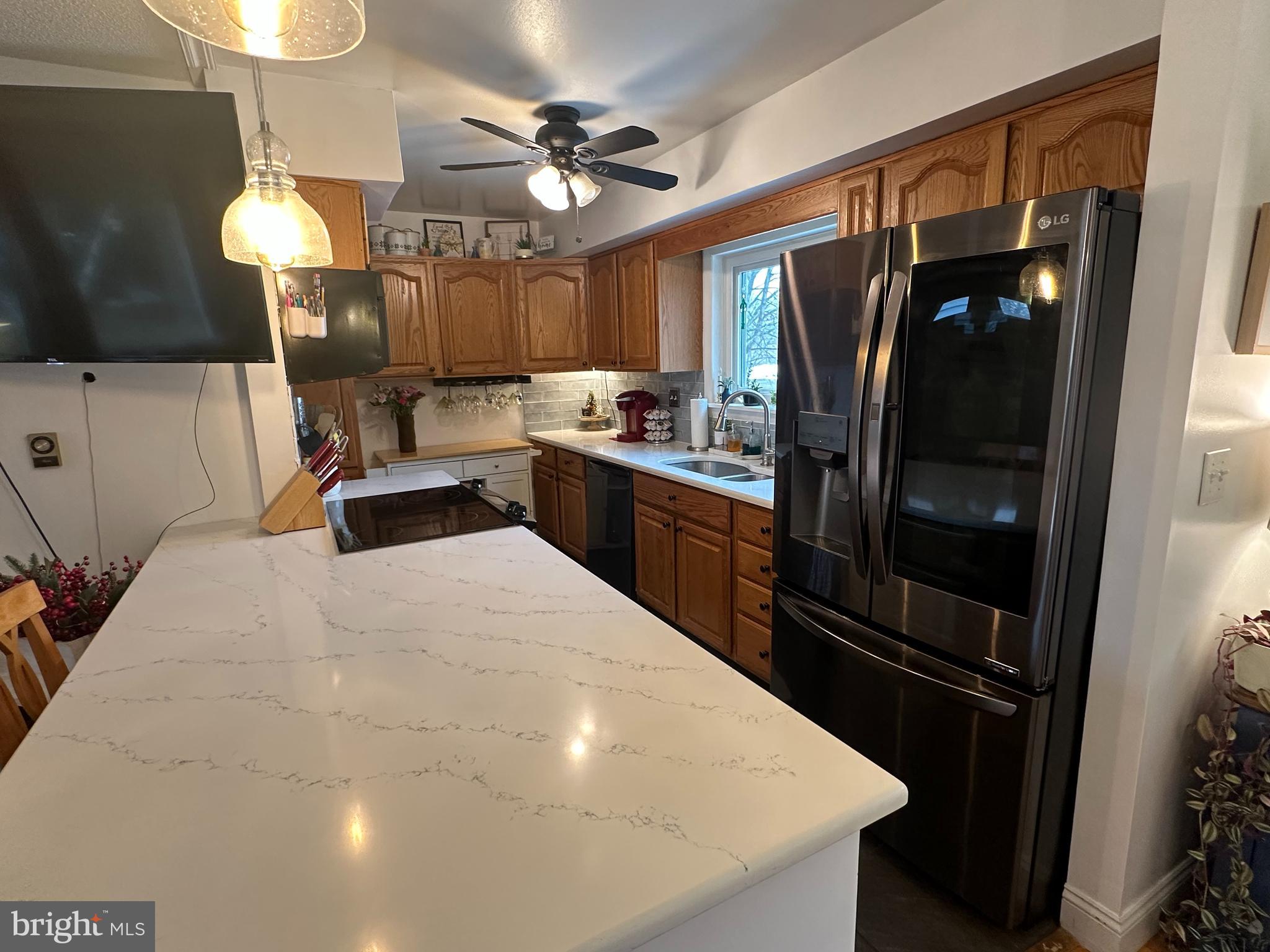 123 Ridge Avenue Centre Hall, PA 16828 - Photo 13 of 37 a kitchen with stainless steel appliances a refrigerator a sink a stove and oven