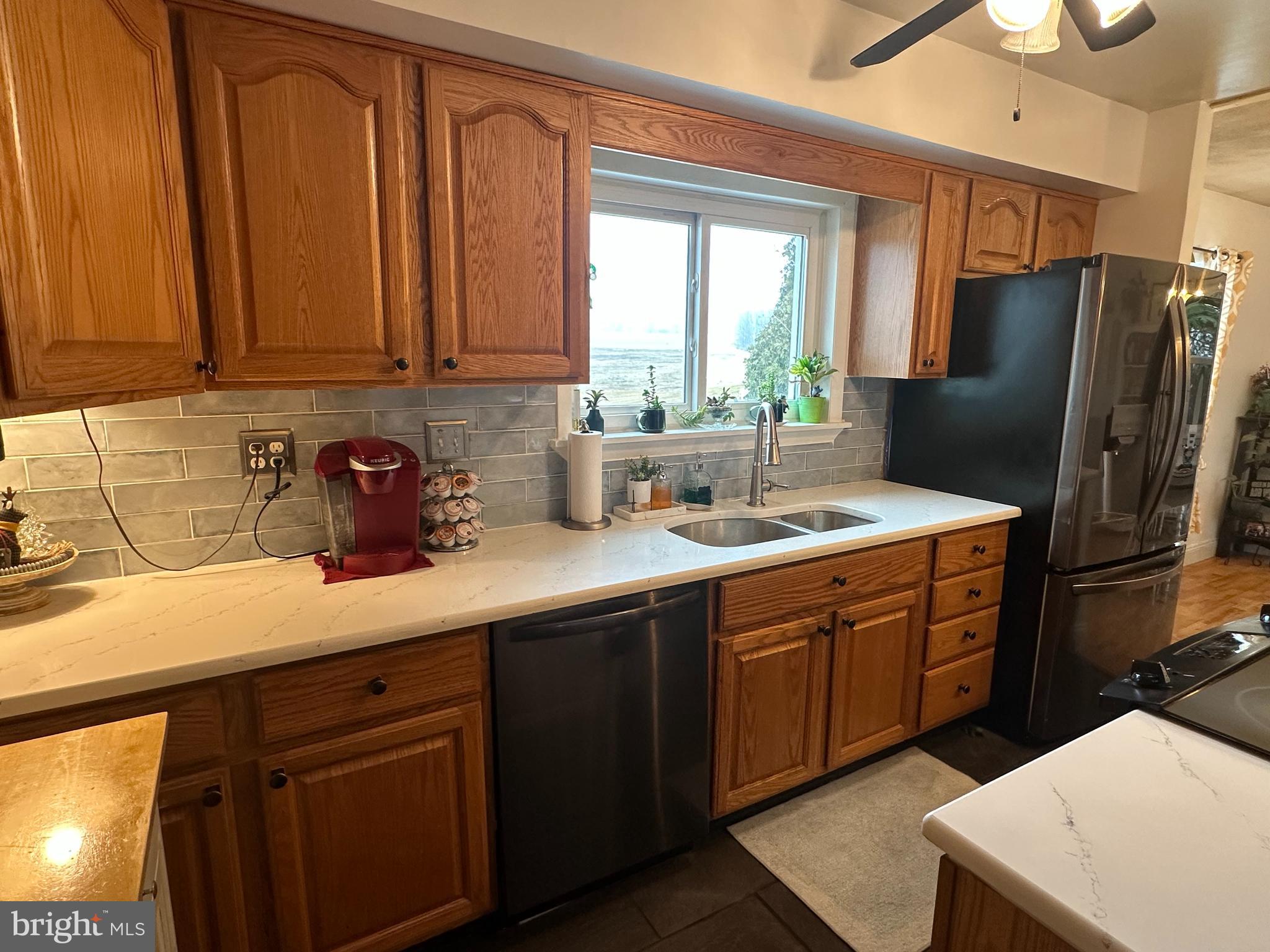 123 Ridge Avenue Centre Hall, PA 16828 - Photo 15 of 37 a kitchen with stainless steel appliances a sink cabinets and a refrigerator