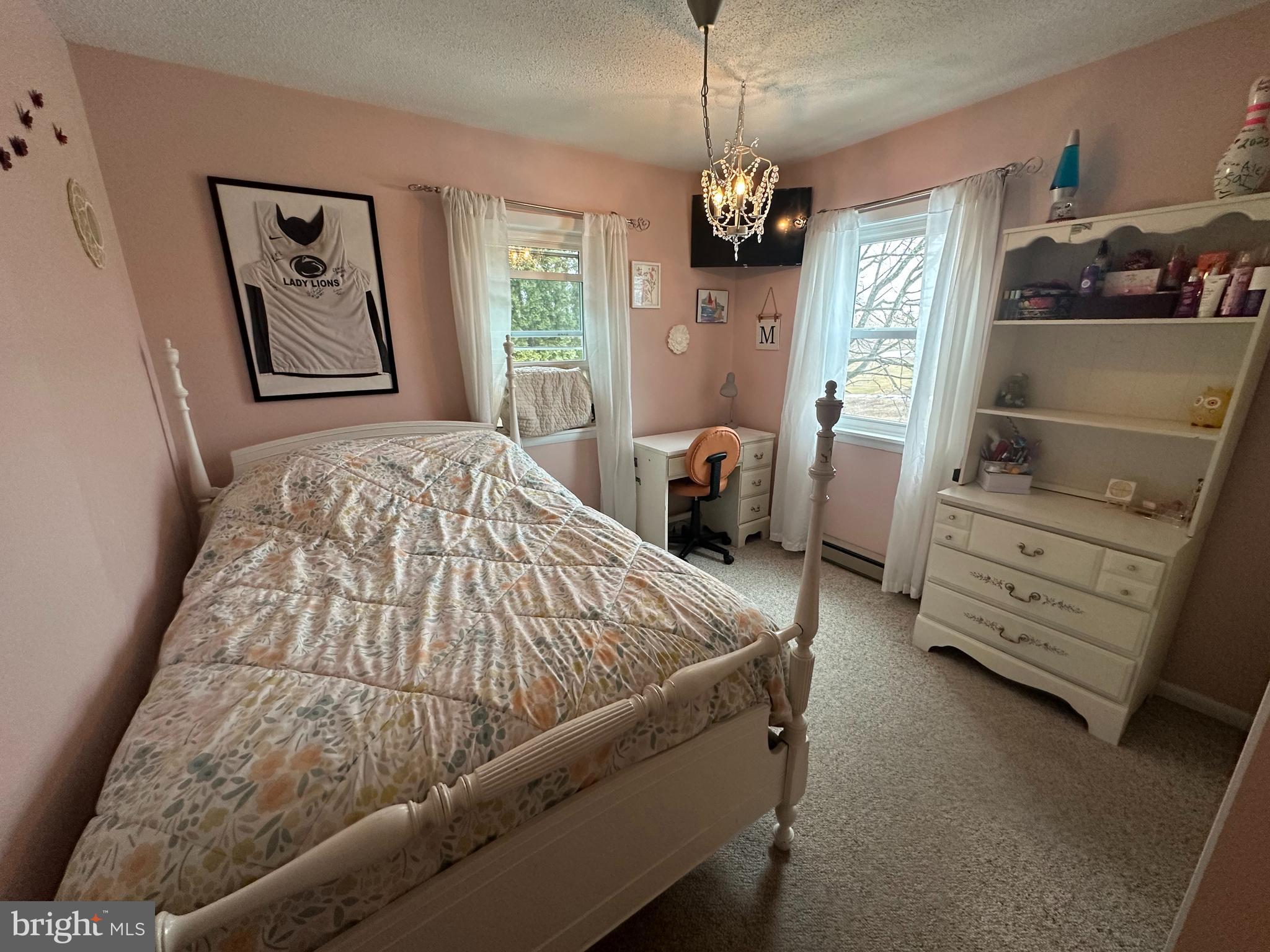123 Ridge Avenue Centre Hall, PA 16828 - Photo 22 of 37 a bed sitting in a bedroom next to a window