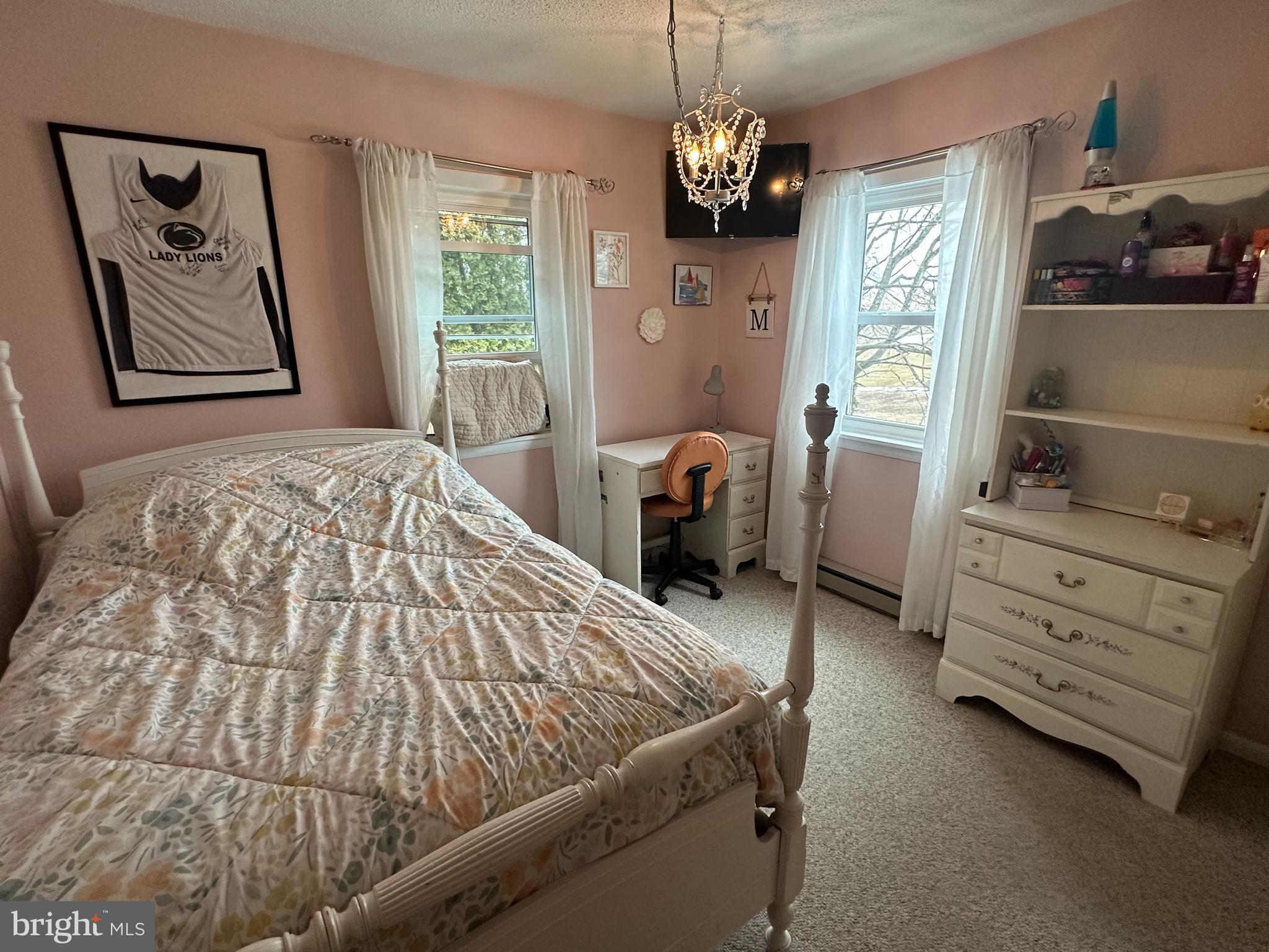 123 Ridge Avenue Centre Hall, PA 16828 - Photo 23 of 37 a bed sitting in a bedroom next to a window