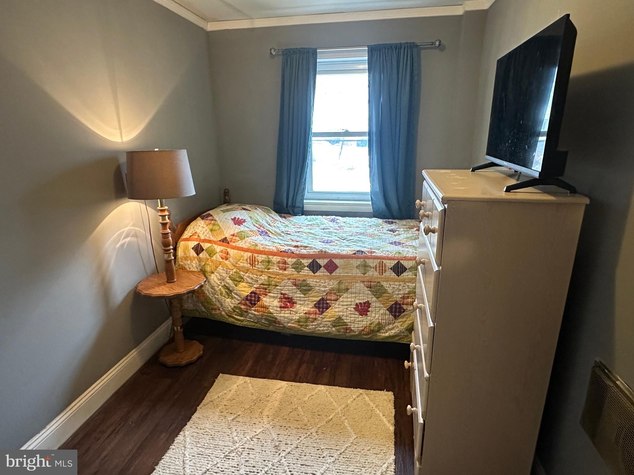 123 Ridge Avenue Centre Hall, PA 16828 - Photo 27 of 37 a bed sitting in a bedroom next to a window