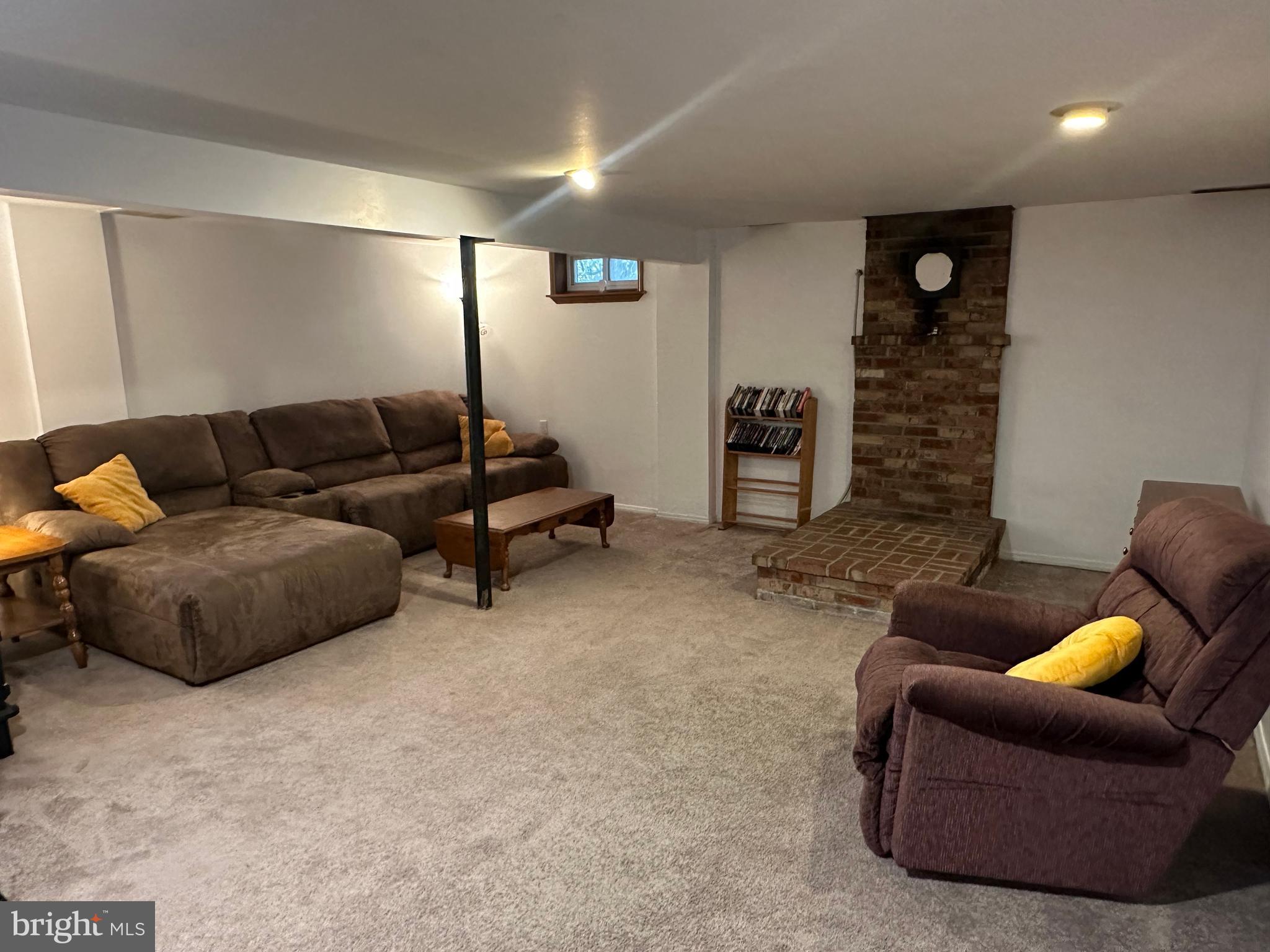 123 Ridge Avenue Centre Hall, PA 16828 - Photo 33 of 37 a living room with furniture and a lamp