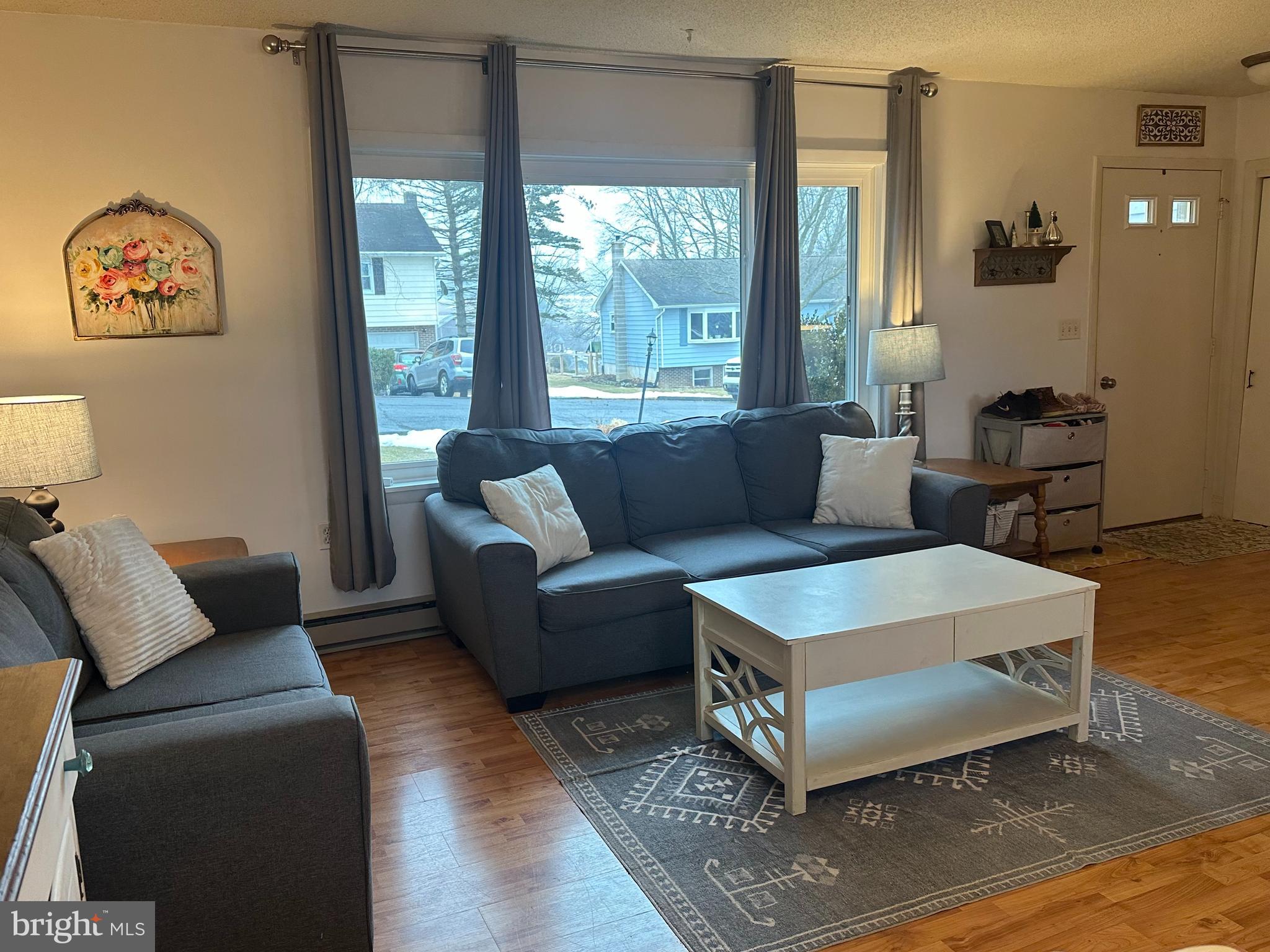 123 Ridge Avenue Centre Hall, PA 16828 - Photo 5 of 37 a living room with furniture and a large window