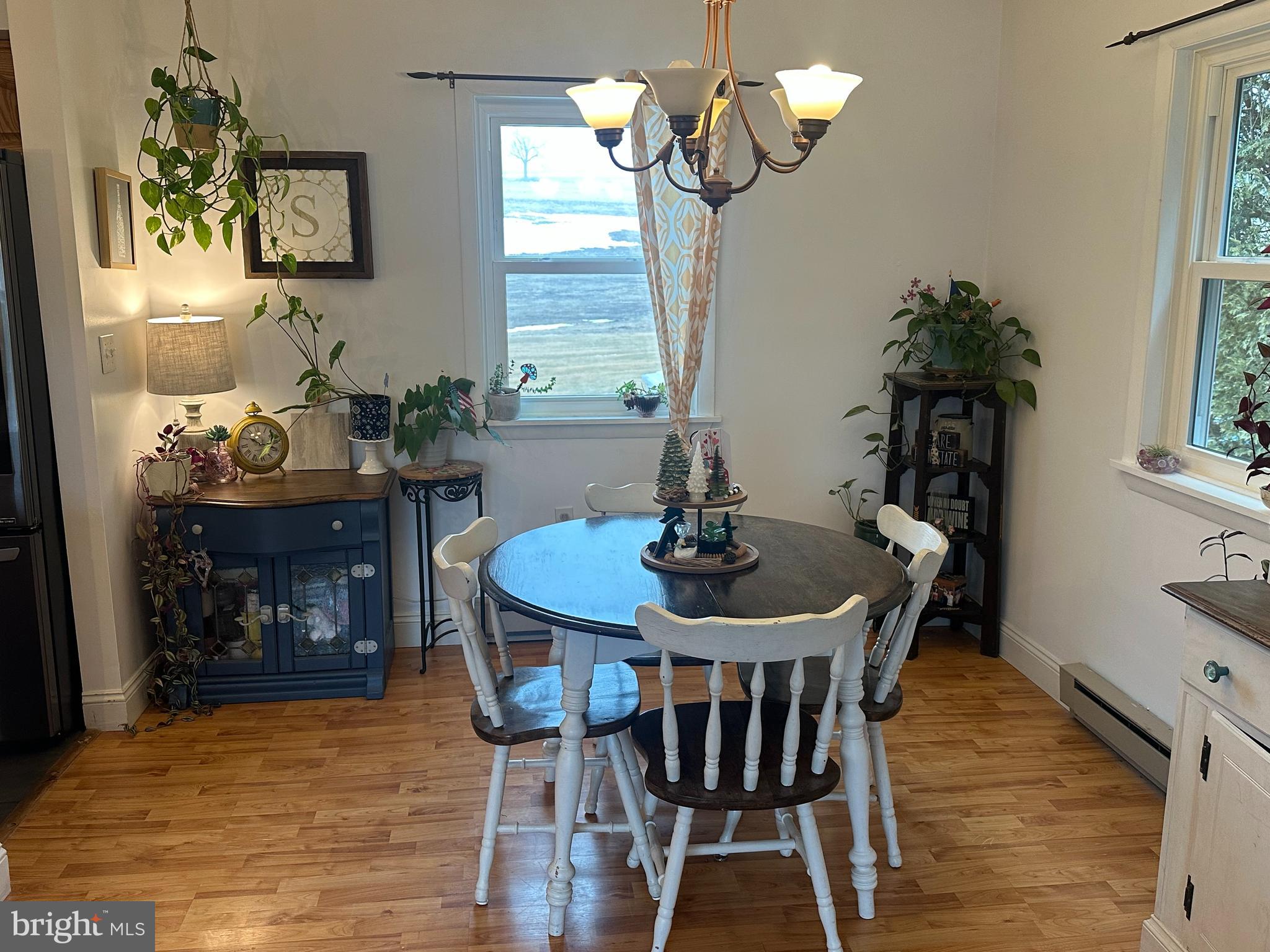 123 Ridge Avenue Centre Hall, PA 16828 - Photo 9 of 37 a view of a dining room with furniture and chandelier
