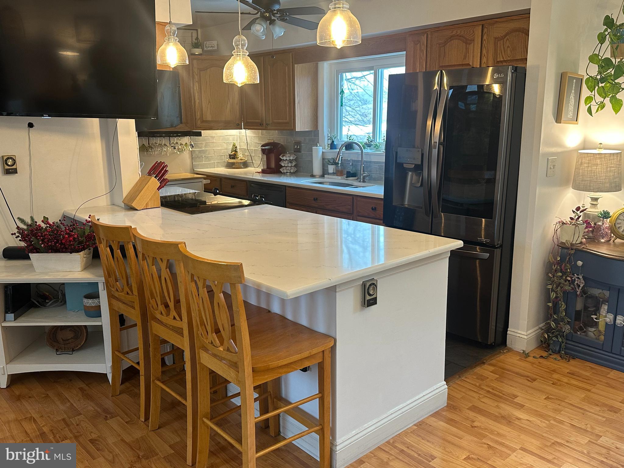 123 Ridge Avenue Centre Hall, PA 16828 - Photo 10 of 37 a kitchen with stainless steel appliances a refrigerator a sink a stove and cabinets