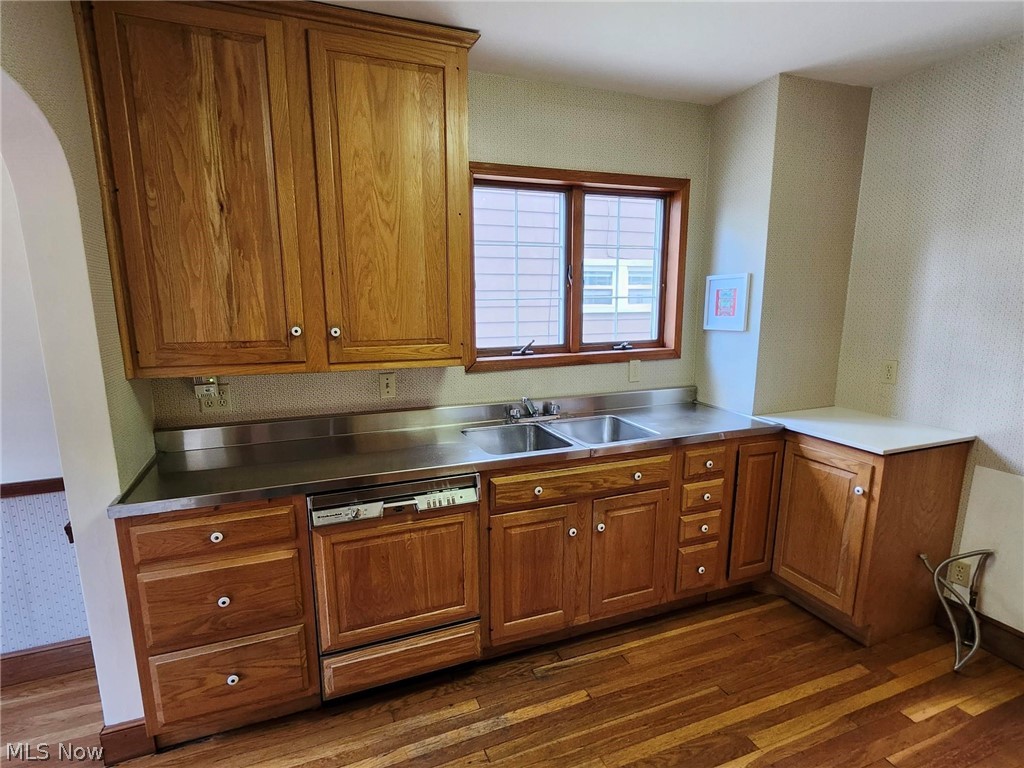 3819 Woodridge Road Cleveland Heights, OH 44121 - Photo 10 of 42 Kitchen featuring stainless steel counters, dishwasher, dark hardwood / wood-style flooring, and sink