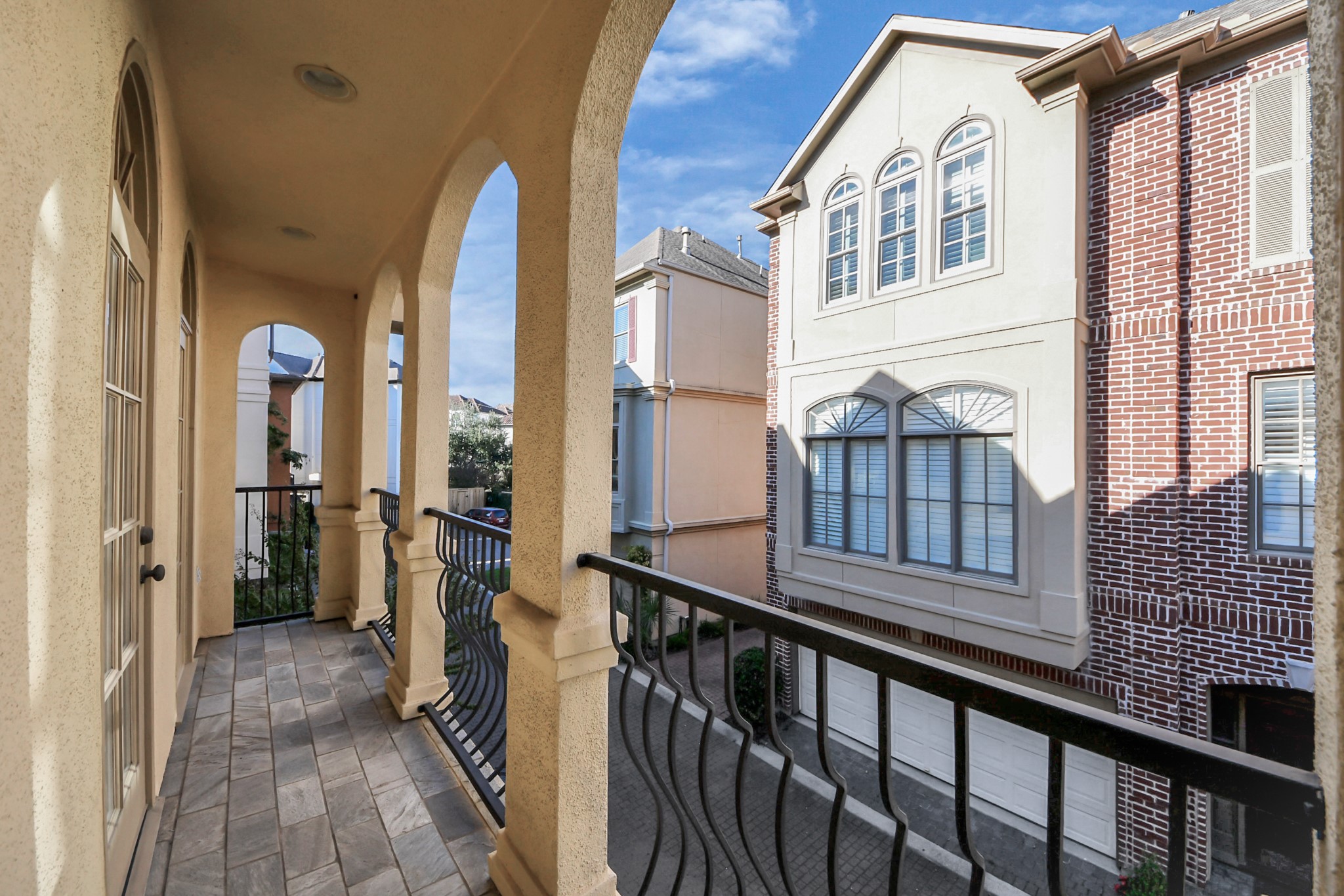 9291 Buffalo Speedway Houston, TX 77025 - Photo 1 of 32 Private terrace access from the primary bedroom.