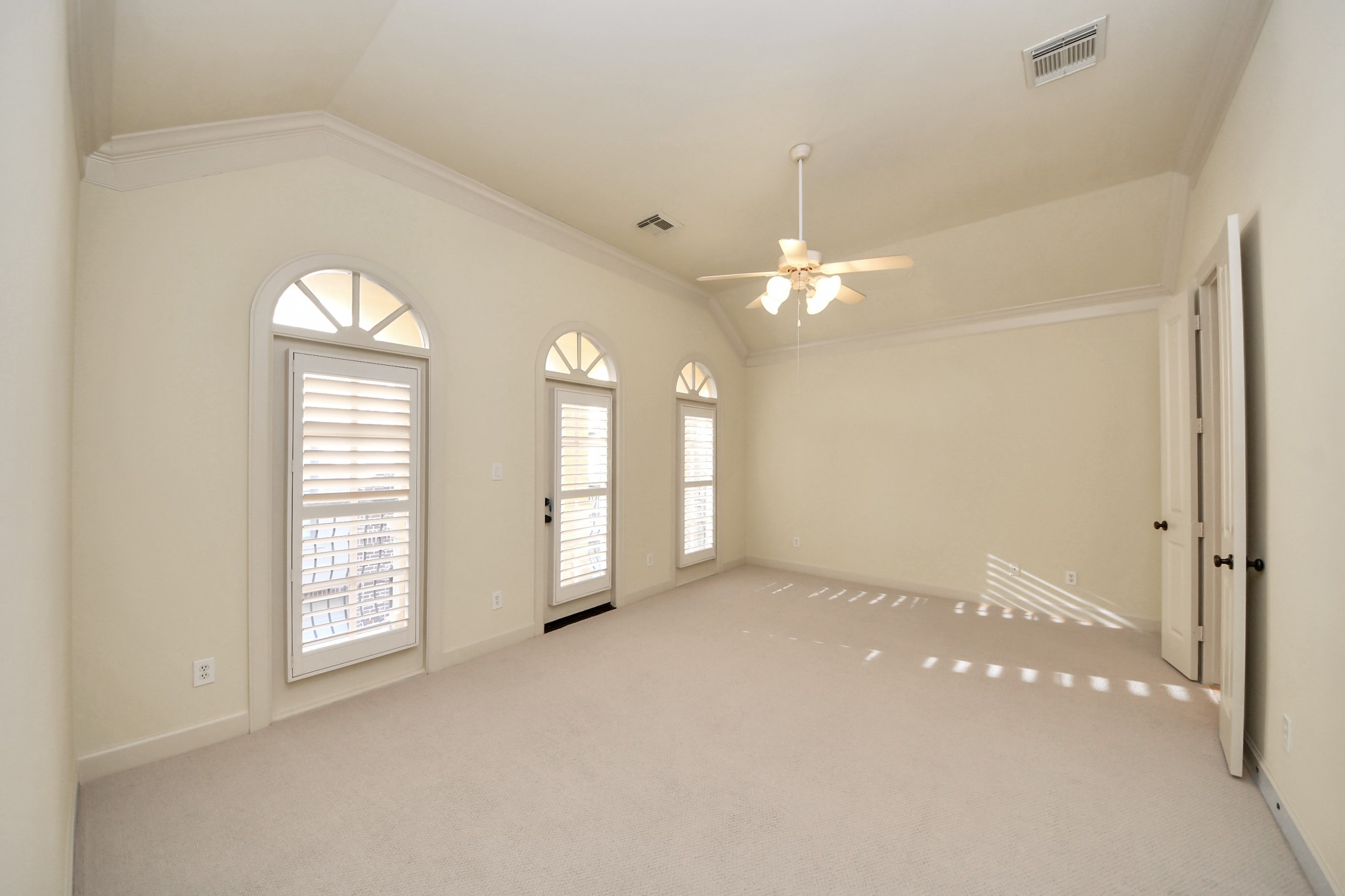 9291 Buffalo Speedway Houston, TX 77025 - Photo 16 of 32 Bright primary bedroom with direct access to a balcony, perfect for morning coffee or evening relaxation.