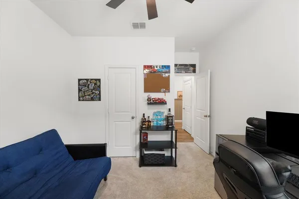 a bedroom with furniture and natural light
