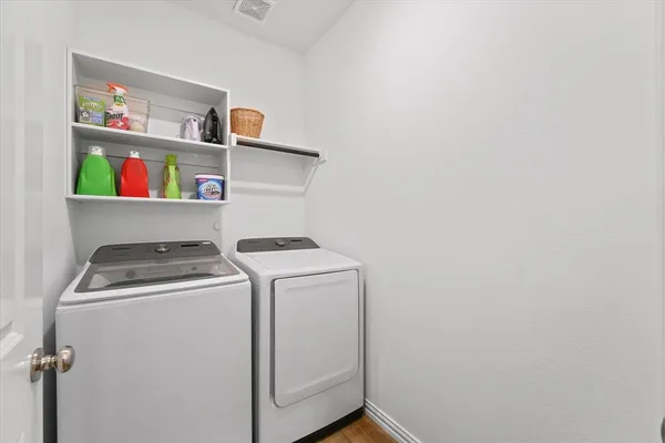 a utility room with dryer and washer