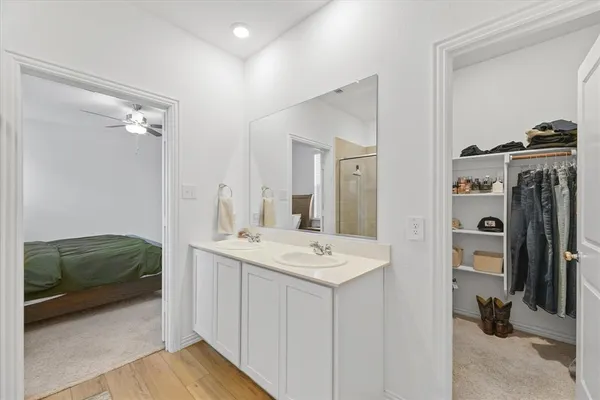 a en suite bathroom with a sink and a mirror