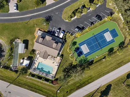 swimming pool with outdoor seating and yard