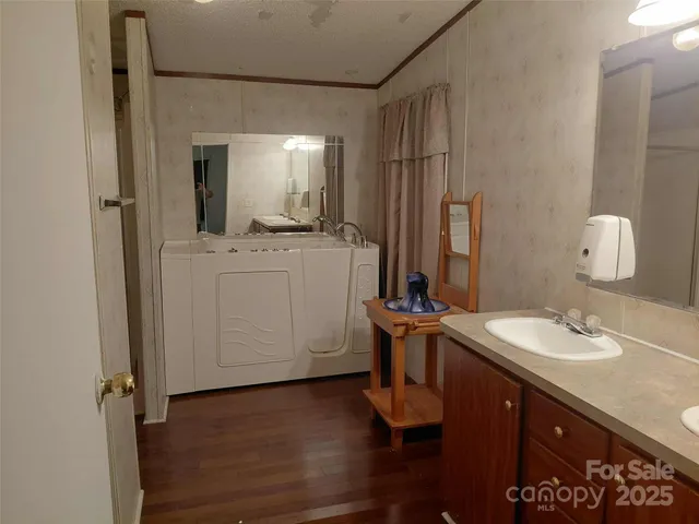 a bathroom with a sink a mirror and a toilet
