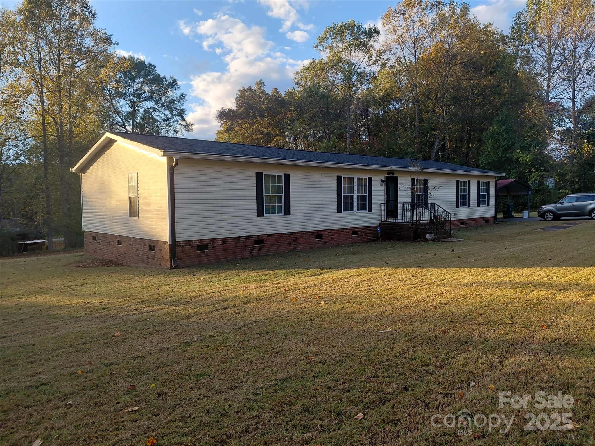 1900 Shady Lane Newton, NC 28658 - Photo 3 of 18 a view of a house with backyard and trees