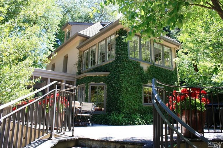 a view of house with outdoor seating and city view