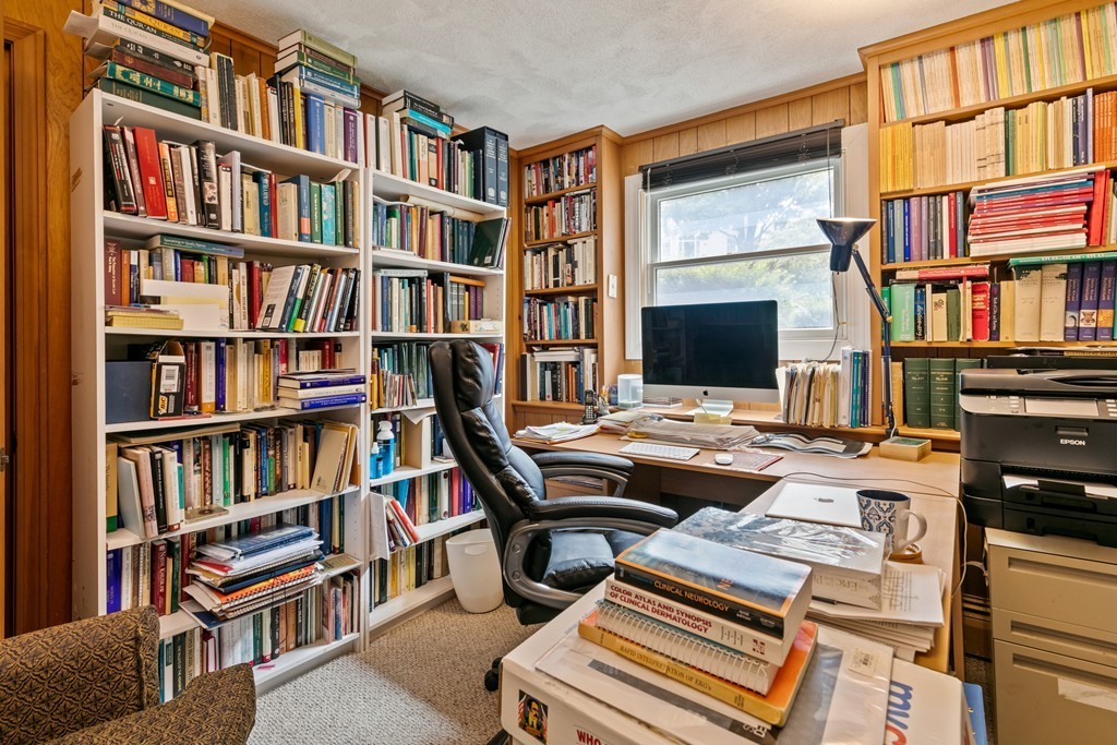 381 Lincoln Street Lexington, MA 02421 - Photo 20 of 35 a view of a workspace with bookshelf and a window