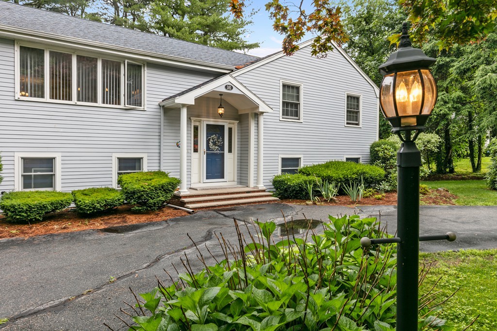 381 Lincoln Street Lexington, MA 02421 - Photo 2 of 35 a view of a house with a yard and plants