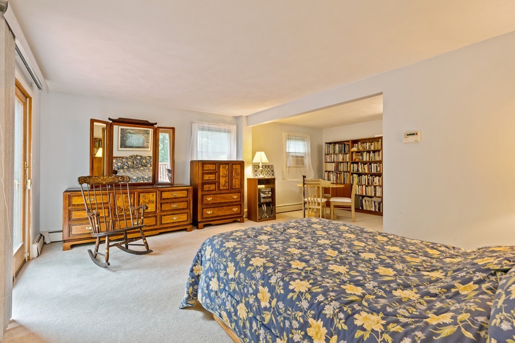 381 Lincoln Street Lexington, MA 02421 - Photo 22 of 35 a bedroom with furniture and natural light