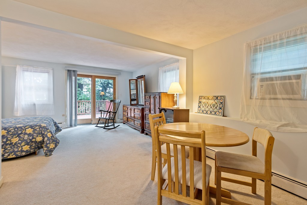 381 Lincoln Street Lexington, MA 02421 - Photo 23 of 35 a living room with furniture and a table