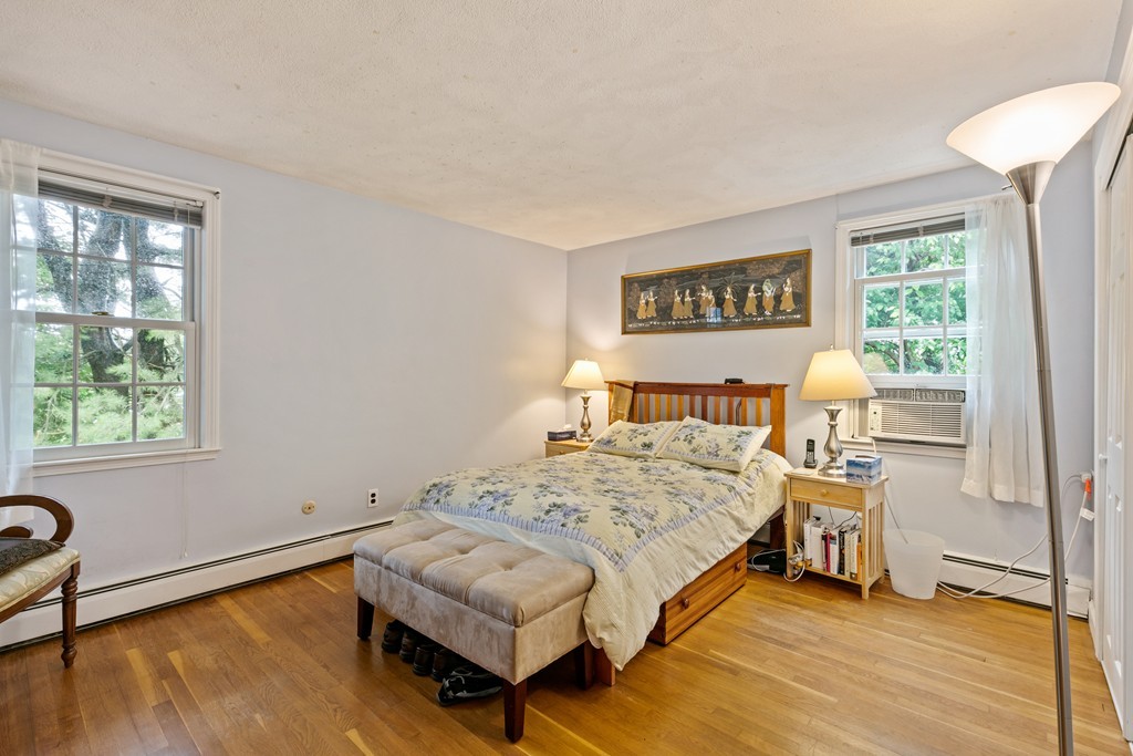 381 Lincoln Street Lexington, MA 02421 - Photo 24 of 35 a bedroom with a bed and a window