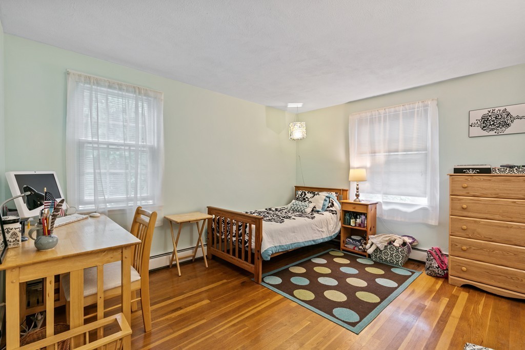 381 Lincoln Street Lexington, MA 02421 - Photo 26 of 35 a bedroom with furniture and a window
