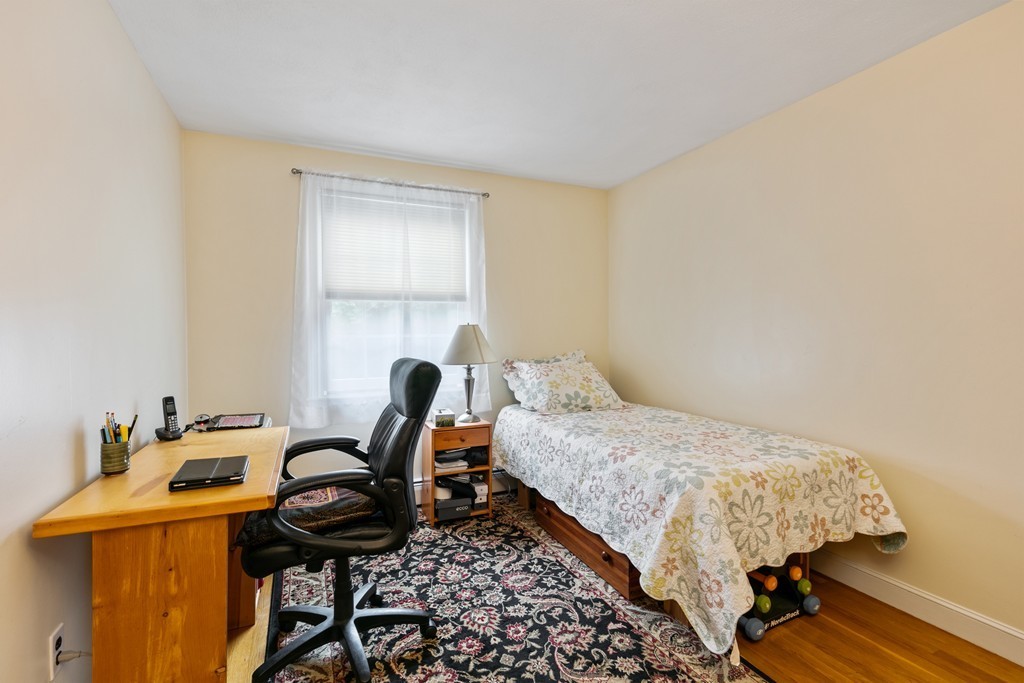 381 Lincoln Street Lexington, MA 02421 - Photo 28 of 35 a bedroom with a bed and a window