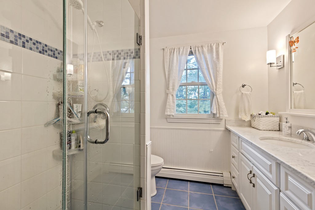 381 Lincoln Street Lexington, MA 02421 - Photo 33 of 35 a bathroom with a granite countertop sink toilet and shower